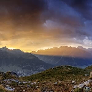 Panorama of the fiery sky on high peaks of Muottas Muragl at sunset, St