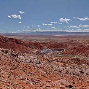 Panorama view from above Sand Hill Spring at Vermilion Cliffs National Monument, with snow covered land in the distance of the Kaibab Plateau, location of the Grand Canyon, Arizona, United States of America, North America