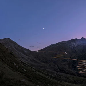Panoramic of lights of car traces at sunset, Spluga Pass, Chiavenna Valley, Switzerland