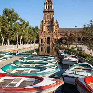 Passenger boats in front of the North Tower of Plaza de Espana, Parque de Maria Luisa
