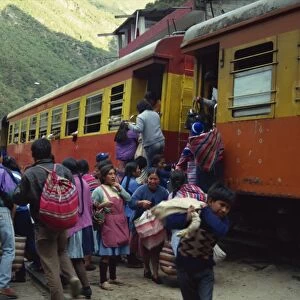 Passengers leaving and boarding the train at the railway