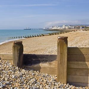 Pebble beach and groynes, Eastbourne Pier in the distance, Eastbourne, East Sussex