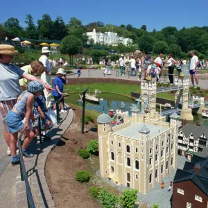 People admiring models of the Tower of London and Tower Bridge, Legoland amusement park