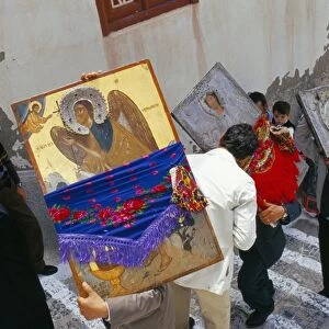 People carrying icons during the celebration of Lambri Triti
