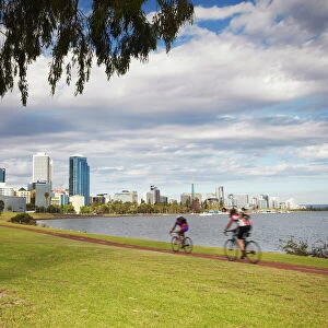 People cycling alongside Swan River, Perth, Western Australia, Australia, Pacific