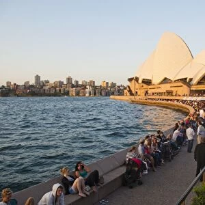 People enjoying the evening in Sydney, drinking at the Opera Bar in front of Sydney Opera House, UNESCO World Heritage Site, Sydney, New South Wales, Australia, Pacific