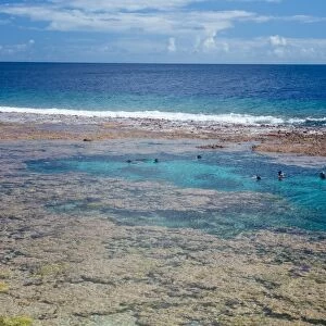 People swimming in the amazing Limu low tide pools, Niue, South Pacific, Pacific