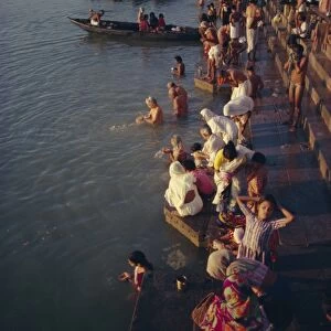 Pilgrims on the ghats by the River Ganges (Ganga)