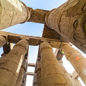 Pillars decorated with Hieroglyphics in the Great Hypostyle Hall at Karnak Temple