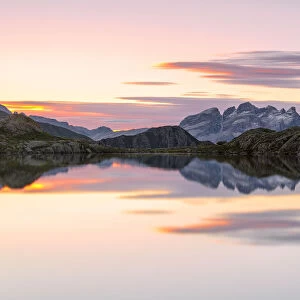 Pink clouds are reflected in Lago Nero at dawn, Cornisello Pinzolo, Brenta Dolomites