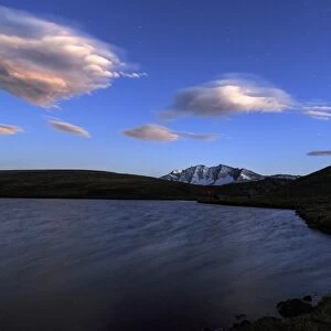 Pink clouds after sunset on Rossett Lake at an altitude of 2709 meters, Gran Paradiso National Park