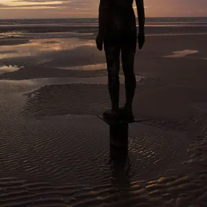 Another Place statues by artist Antony Gormley on Crosby beach, Merseyside