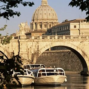 Pleasure boats on the River Tiber near the Ponte Sant Angelo, with St