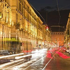Via Po avenue lit up at night by passing traffic, Turin, Piedmont, Italy, Europe