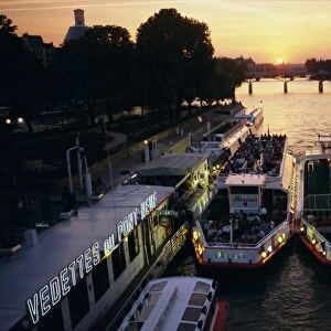 Pont Neuf and tour boats on the River Seine at sunset, Paris, France, Europe