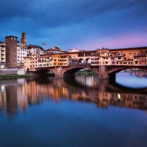 Ponte Vecchio at night reflected in the River Arno, Florence, UNESCO World Heritage Site