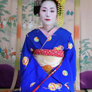 Portrait of a Geisha in a traditional Japanese style tatami mat room