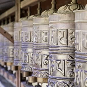 Prayer wheels at the Buddhist monastery in Tengboche in the Khumbu region of Nepal, Asia