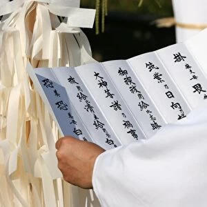 Priest reading a prayer for peace at Shinto ceremony, Lyon, Rhone, France, Europe