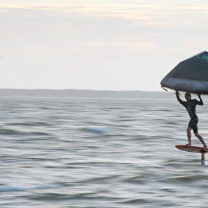 Pro surfer James Jenkins flies above the Atlantic Ocean on his wing surfer at Nags Head