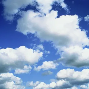 Puffy white clouds in a blue sky in England, United Kingdom, Europe