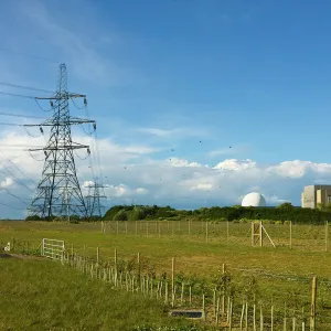 Pylons and the Sizewell A nuclear power station on the right, now closed, and the domed Sizewell B pressurised water reactor, Sizewell, Suffolk, England, United Kingdom, Europe