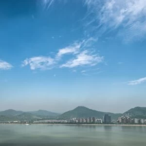 Qiantang River, hills and high rises of Hangzhou, Zhejiang, China, Asia