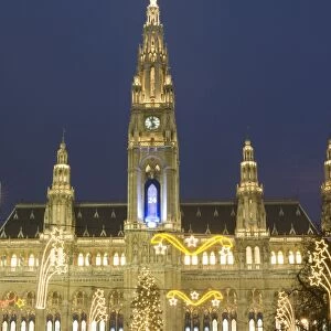 Rathaus (Town Hall) with Christmas decorations at Rathausplatz at twilight