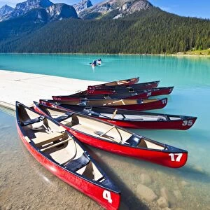 Red canoes for hire on Lake Louise, Banff National Park, UNESCO World Heritage Site, Alberta, The Rockies, Canada, North America