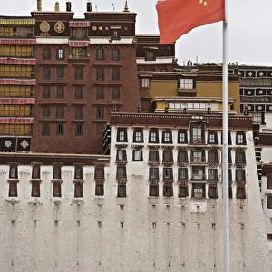 The red flag of China flies in front of the Potala Palace, UNESCO World Heritage Site