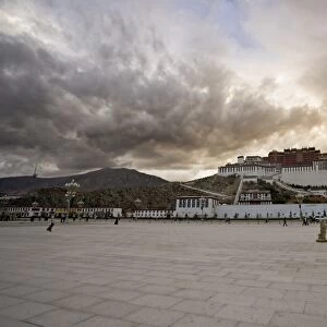 The red flag of China flying in Potala Square on a stormy afternoon in front of the Potala Palace