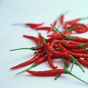 Red hot chillies on a white sheet