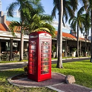 Red telephone box in downtown Oranjestad, capital of Aruba, ABC Islands, Netherlands Antilles, Caribbean, Central America