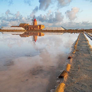 Reflection of the windmill in the salt flats at dawn, Saline Ettore e Infersa, Marsala, province of Trapani, Sicily, Italy, Mediterranean, Europe