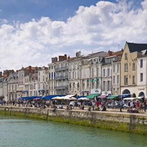 Restaurants lining the edge of the marina in the ancient port of La Rochelle