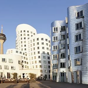 Rheinturm tower and Gehry Haus building, Medienhafen, Dusseldorf, North Rhine-Westphalia, Germany, Europe