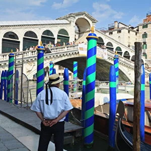 Rialto Bridge and gondolier, Grand Canal, Venice, UNESCO World Heritage Site