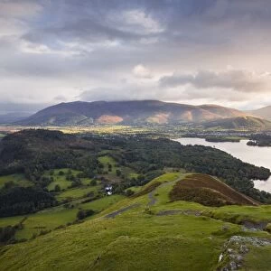 The rising sun lights up the fells of Skiddaw and Blencartha, Lake District National Park, Cumbria, England, United Kingdom, Europe