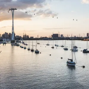 River Thames at sunset and the Emirates Air Line Cable Car, East London, England