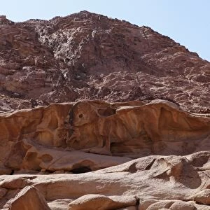 A rock carving depicts the Golden Calf of the Old Testament under Mount Sinai