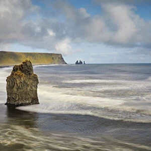 A rocky Atlantic shoreline on Dyrholaey Island, looking towards Reynisfjara beach, near Vik, south coast of Iceland, Polar Regions