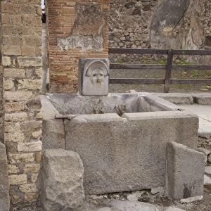 Roman drinking fountain on Via Stabiana, Pompeii, UNESCO World Heritage Site
