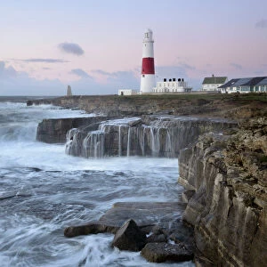Rough seas crash over rocks near Portland Bill Lighthouse, Dorset, England, United Kingdom