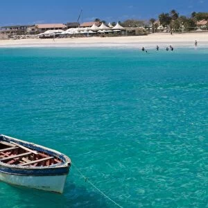 Rowboat in blue sea off coast, Santa Maria, Sal, Cape Verde Islands, Atlantic, Africa