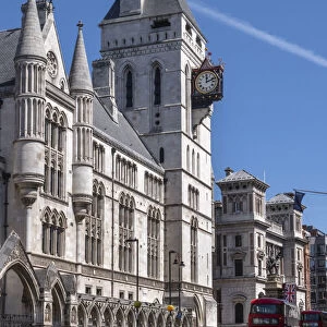 The Royal Courts of Justice, Central Civil Court, and red London bus on Fleet Street