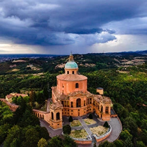 Sanctuary of Madonna di St. Luca, the symbol of Bologna, at sunset during a storm
