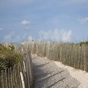 Sand held in place by fence on South Beach in Miami Beach, Florida, United States of America