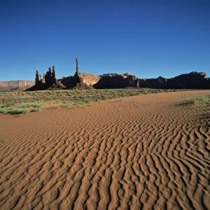 Sand ripples and rock formations in Monument Valley