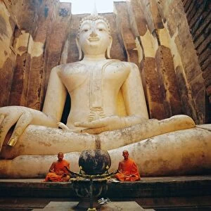 Seated Buddha and monks meditating