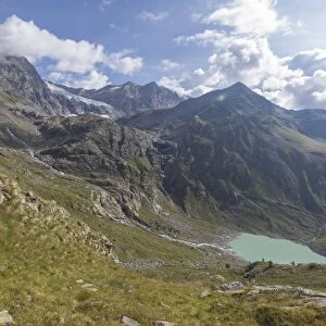 Sentiero Glaciologico and water basin and dam of Alpe Gera on the background, Malenco Valley